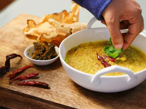 A bowl of moong dal khichdi with vegetables
